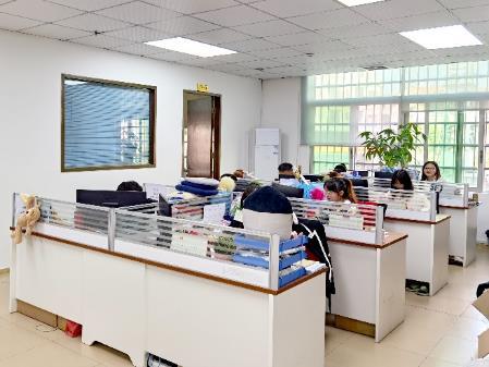 The business office at the Dongguan factory, with staff working at desk level